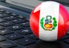 Perú permite la venta de loterías en más comercios bandera de perú sobre teclado