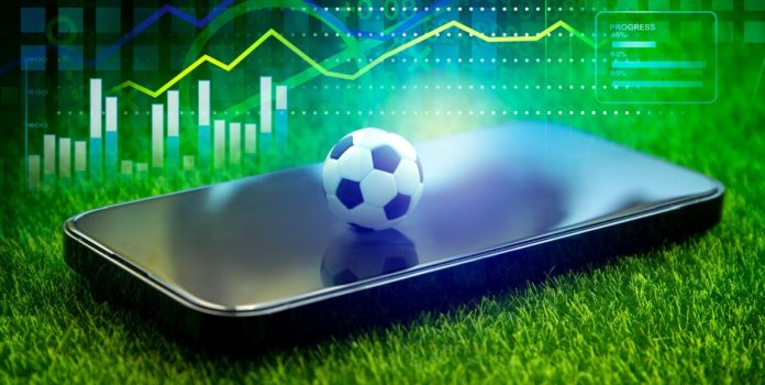 sinapo sinapo, celular con pelota de fútbol arriba